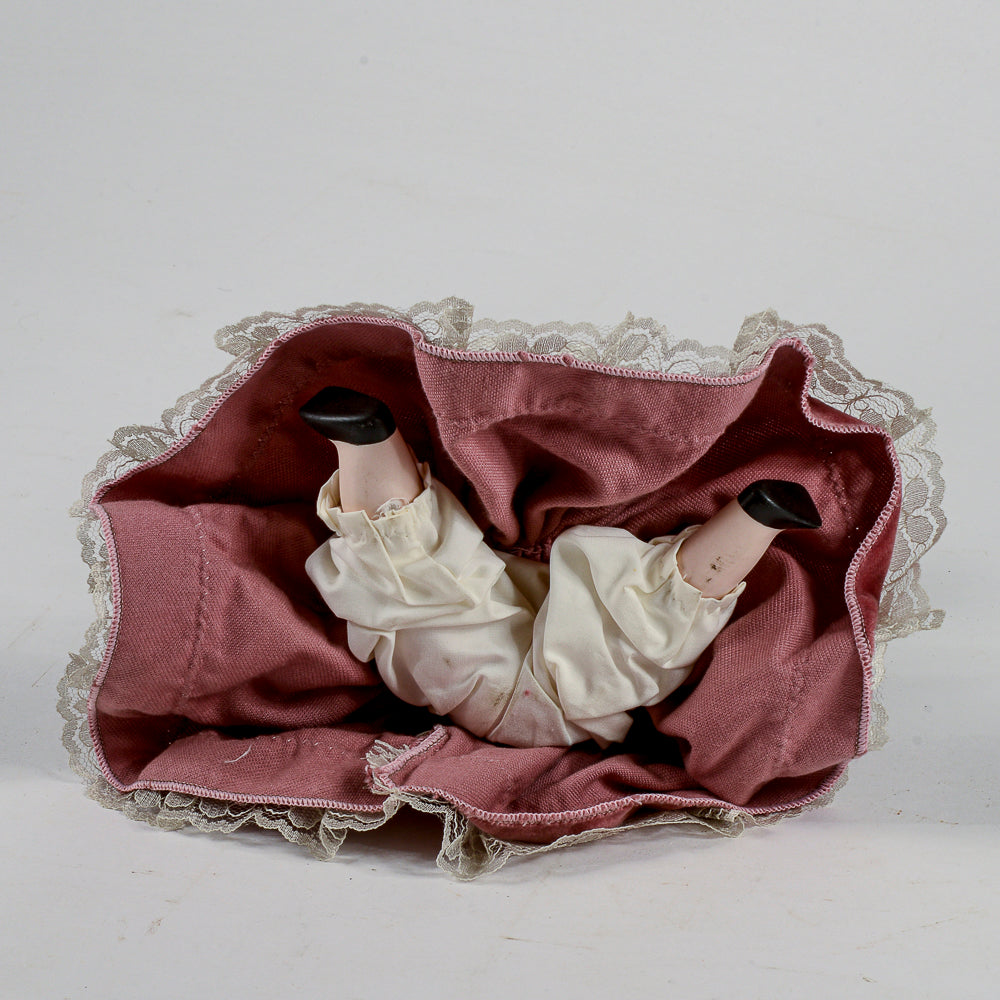 Bambola in porcellana vestito in velluto rosa antico