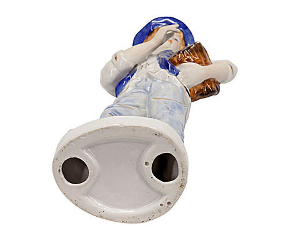 Statuina in ceramica uomo con cappello e fascio di legna