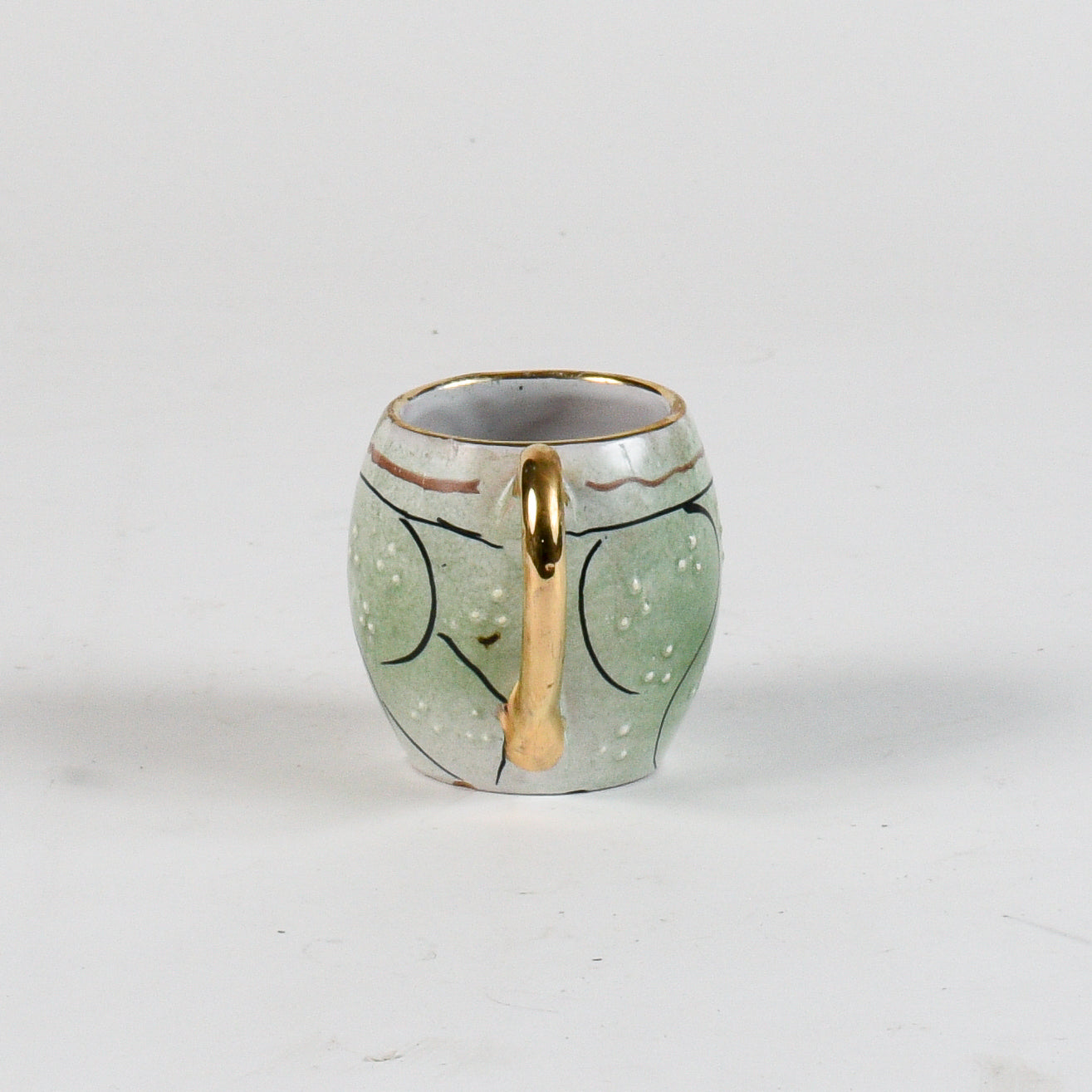 tazza decorata verde con borso oro scritta bevi amore