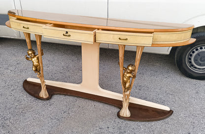 Consolle in pergamena e legno con  putti dorati e piano in vetro firmata Associazione Artigiani Canturini  Italia 1950
