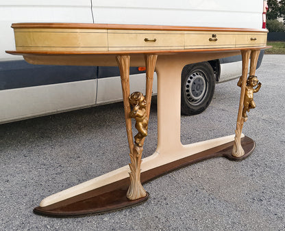 Consolle in pergamena e legno con  putti dorati e piano in vetro firmata Associazione Artigiani Canturini  Italia 1950