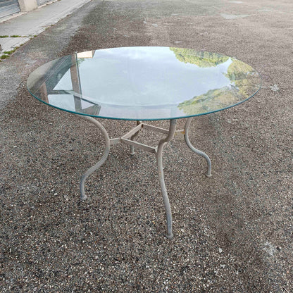 Tavolo in ferro da esterno piano rotondo in vetro produzione 1990