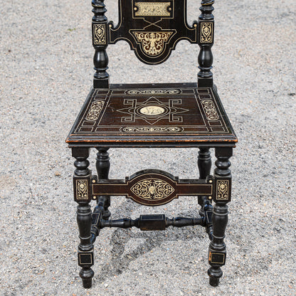 Sedia tinta ebano  intarsiata  con decori a rilievo stile  Pogliani epoca fine 800