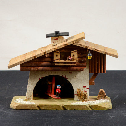 barometro a forma di casa con personaggi mobili