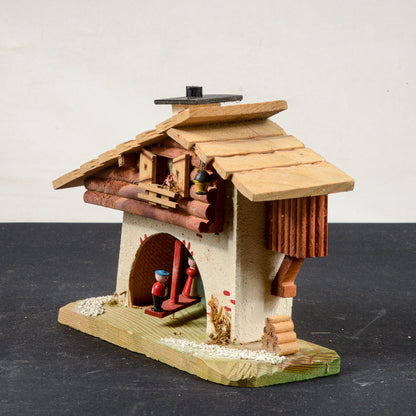barometro a forma di casa con personaggi mobili