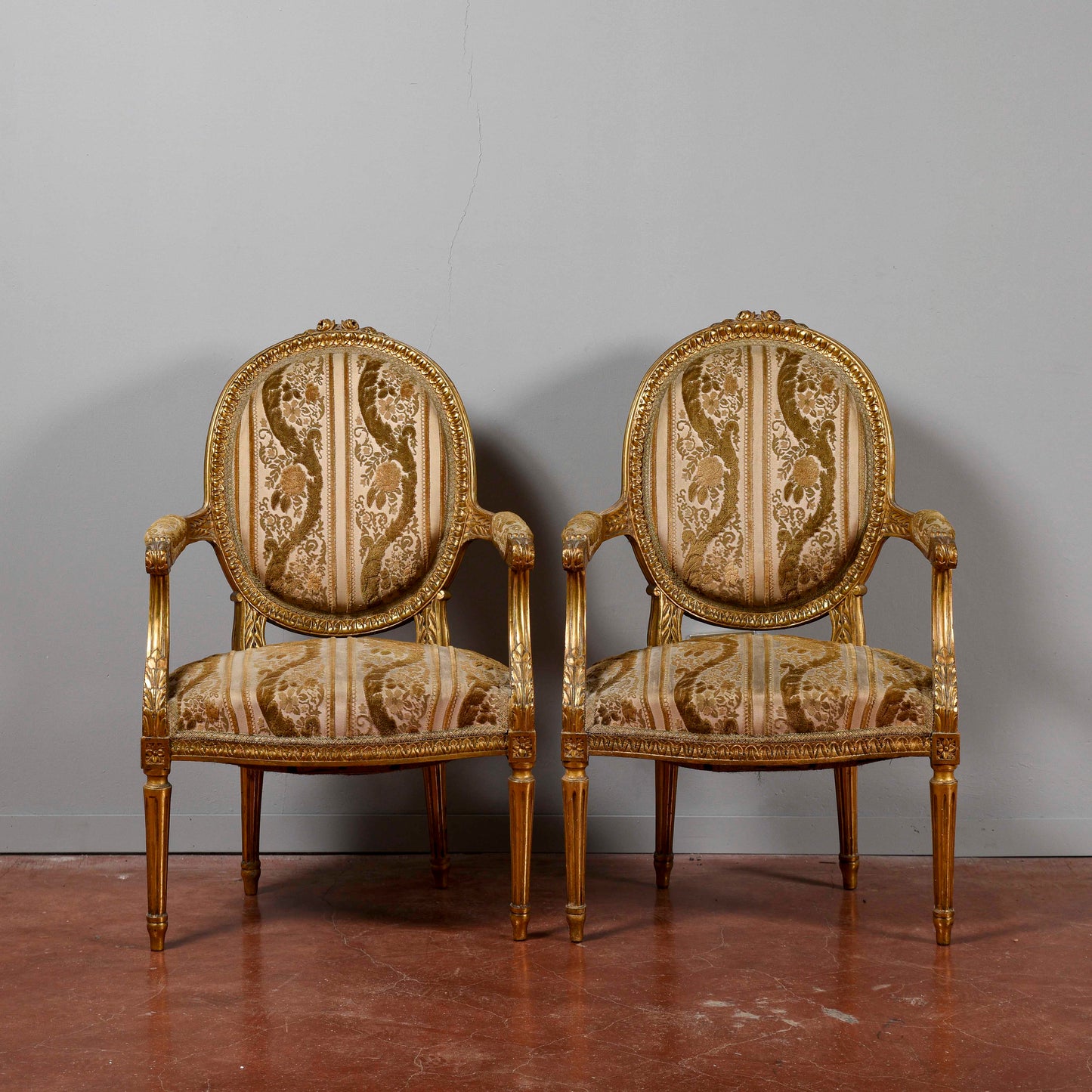 Coppia di poltrone dorate stile Napoleone III