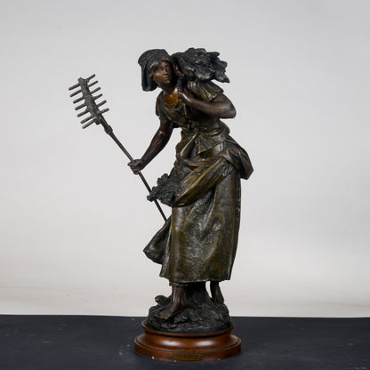 Scultura in metallo firmata Auguste Moreau Faneuse  la mietritrice