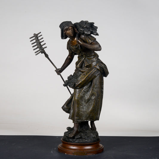 Scultura in metallo firmata Auguste Moreau Faneuse  la mietritrice