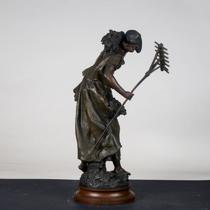 Scultura in metallo firmata Auguste Moreau Faneuse  la mietritrice