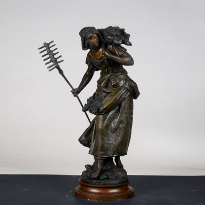 Scultura in metallo firmata Auguste Moreau Faneuse  la mietritrice