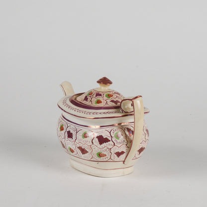 Teiera in ceramica smaltata finitura a lustro XX secolo