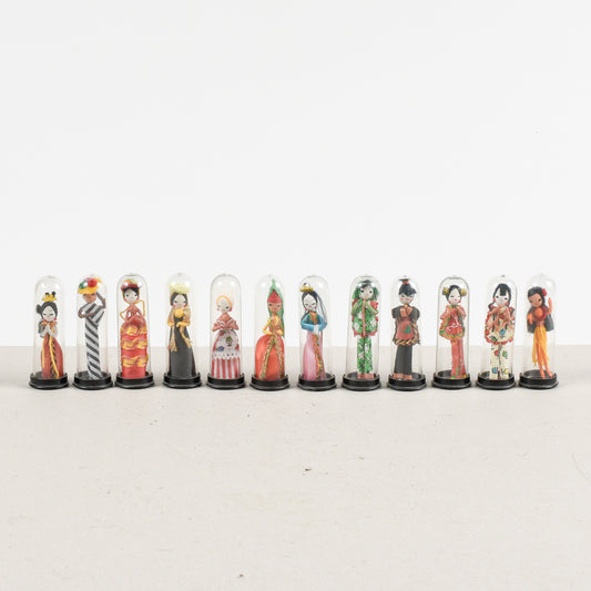 set collezione di 11 bamboline orientali sotto teca