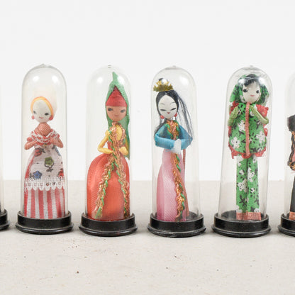 set collezione di 11 bamboline orientali sotto teca