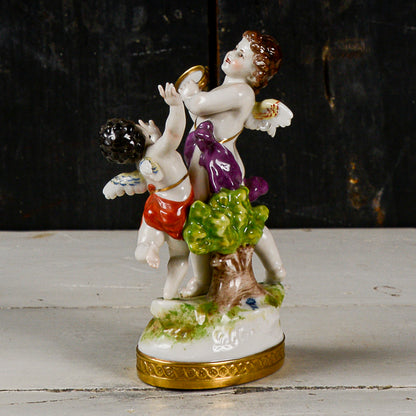 Statua scultura capodimonte putti musicisti danzanti con cembalo
