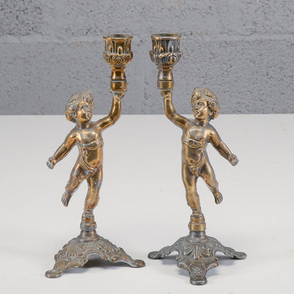 Coppia candelieri putti in metallo XX secolo
