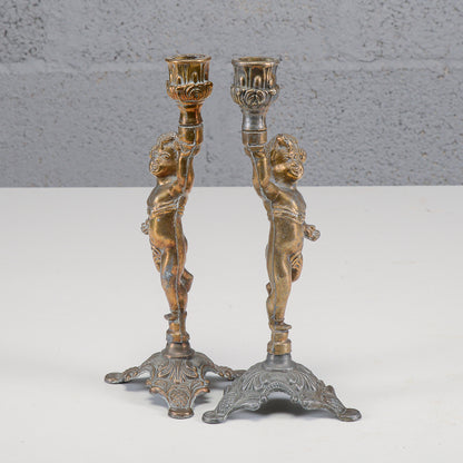 Coppia candelieri putti in metallo XX secolo