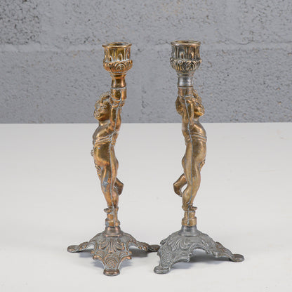 Coppia candelieri putti in metallo XX secolo