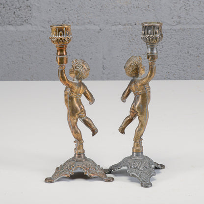 Coppia candelieri putti in metallo XX secolo