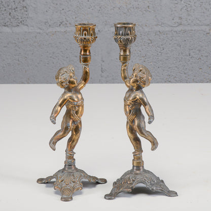 Coppia candelieri putti in metallo XX secolo
