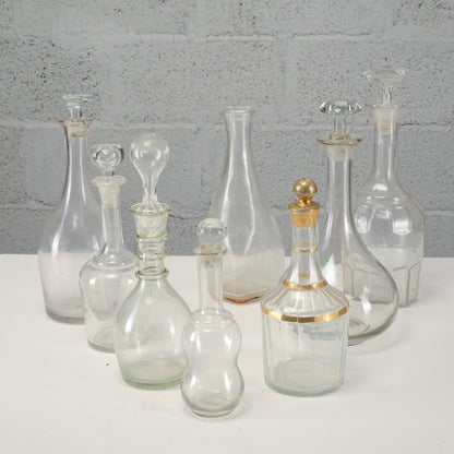 Serie di bottiglie varie decanter, in vetro lavorato XX secolo