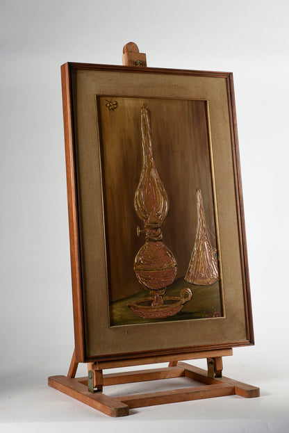 Quadro materico con cornice,  raffigurante lampada ad olio Italia 1970