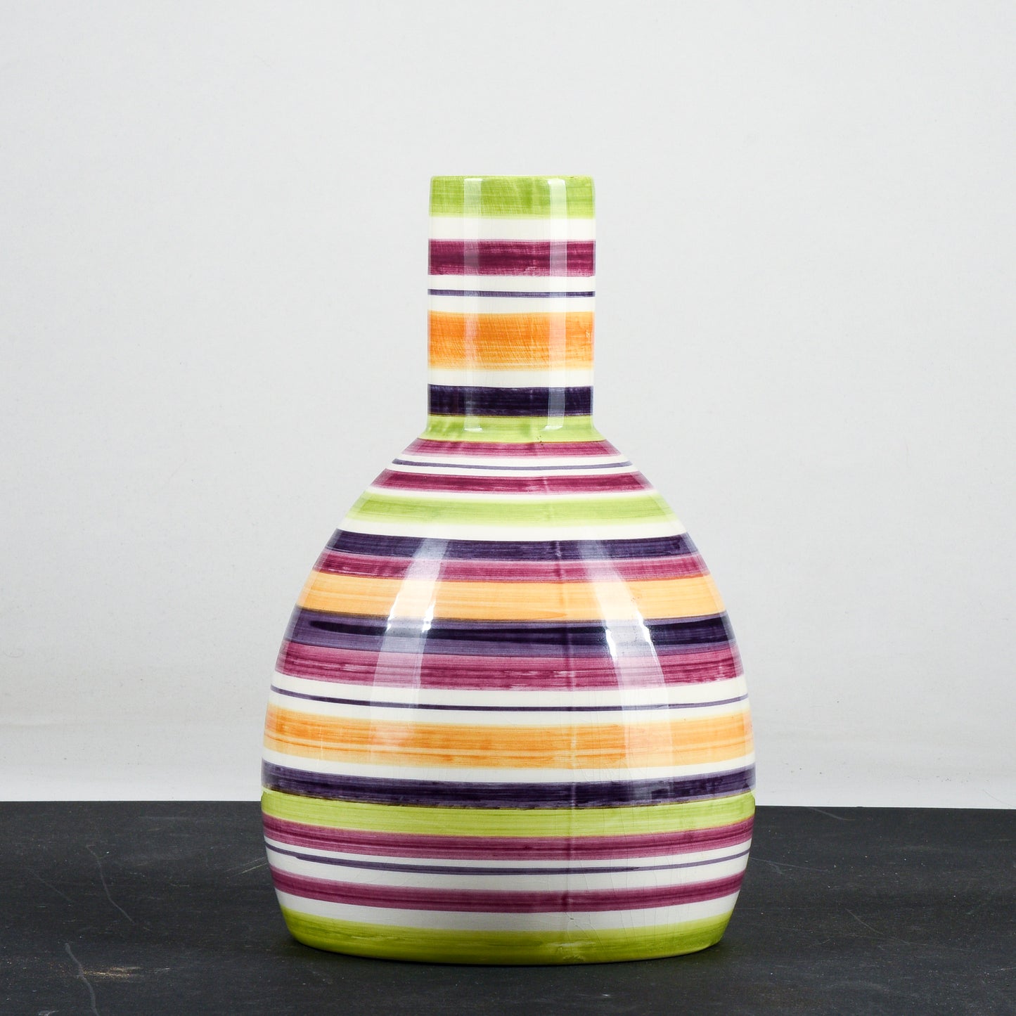 Vaso bottiglia in ceramica multicolore a righe con cerchi concentrici anni 1990