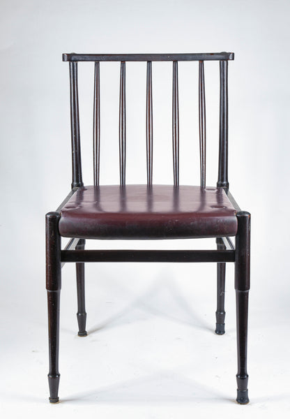 Sedia vintage in legno tinto scuro e similpelle con segni del tempo anni 60