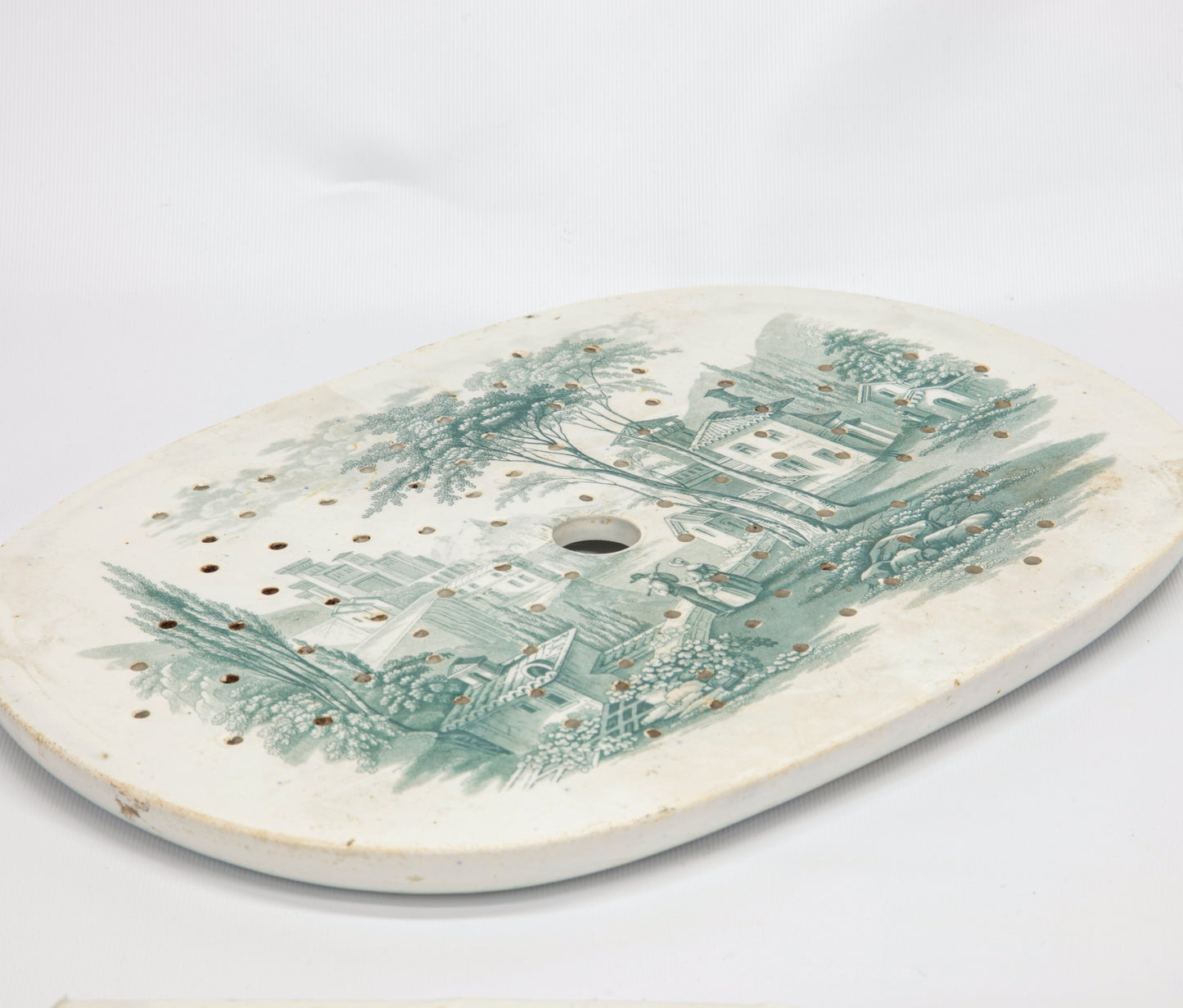 Piatto ovale sottopentola traforato in ceramica epoca fine IXI secolo