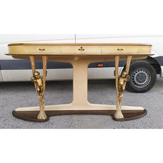 Consolle in pergamena e legno con  putti dorati e piano in vetro firmata Associazione Artigiani Canturini  Italia 1950