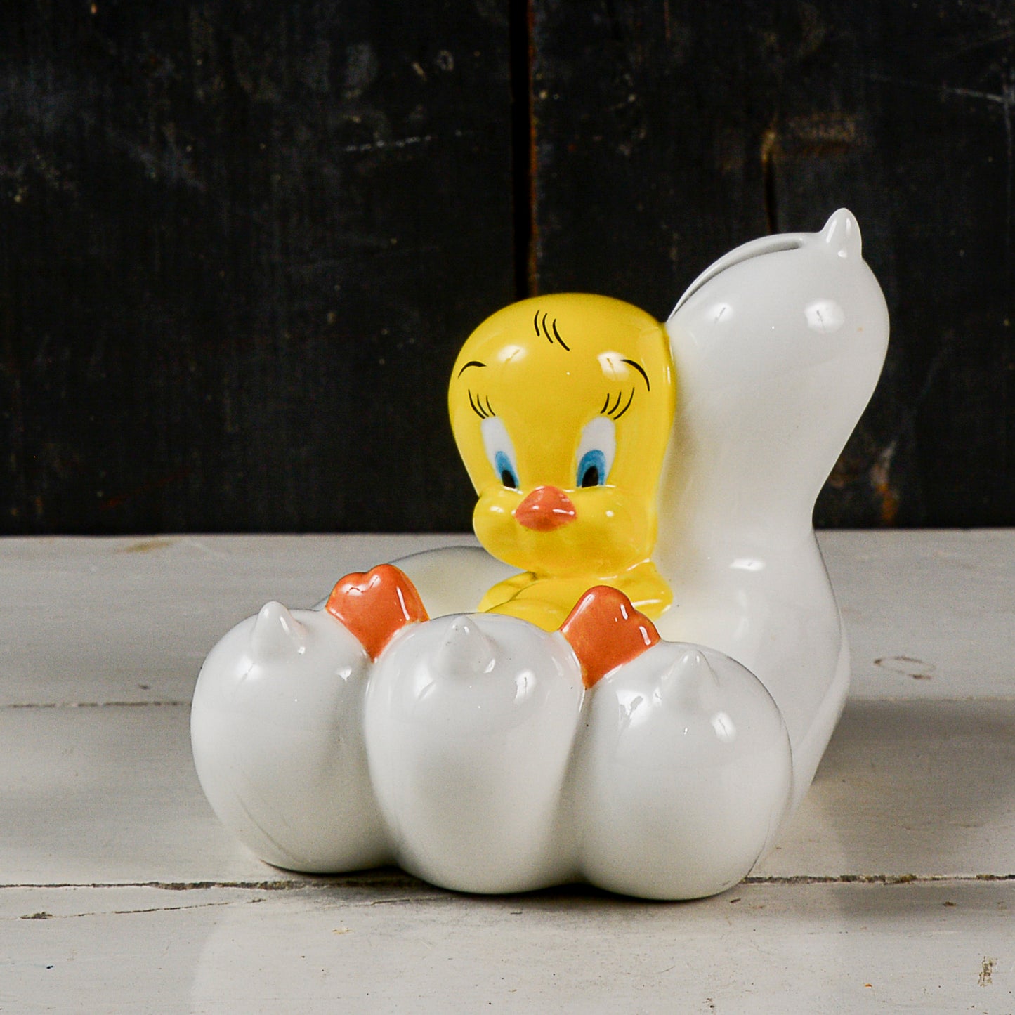 salvadanaio scultura titti su zampa di silvestro