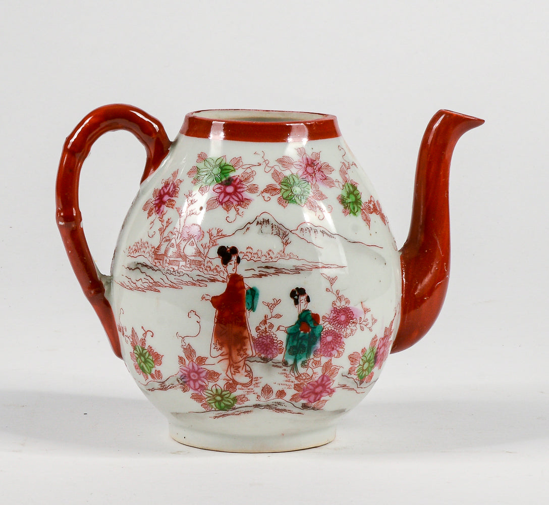 Teiera cinese orientale con decori a rilievo