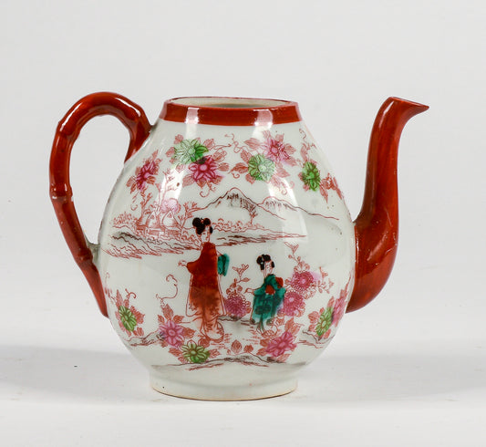 Teiera cinese orientale con decori a rilievo